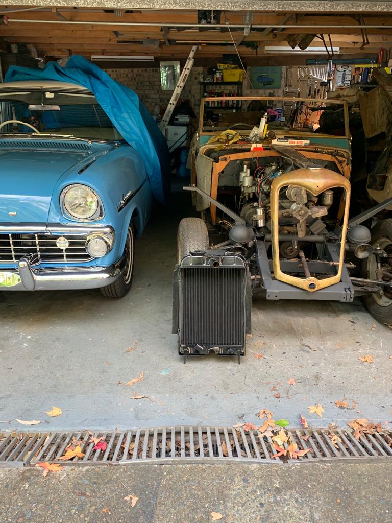 Arthur Tarakjian of North Shore Radiators working on classic car's radiator